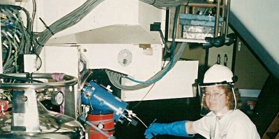 Sheila Crosby filling an instrument with liquid nitrogen in the Isaac Newton Telescope in 2003, with protective clothing.