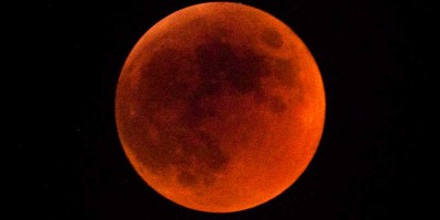 The Moon blood red because it's completely inside the Earth's shadow.