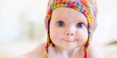 Baby in a bright hat